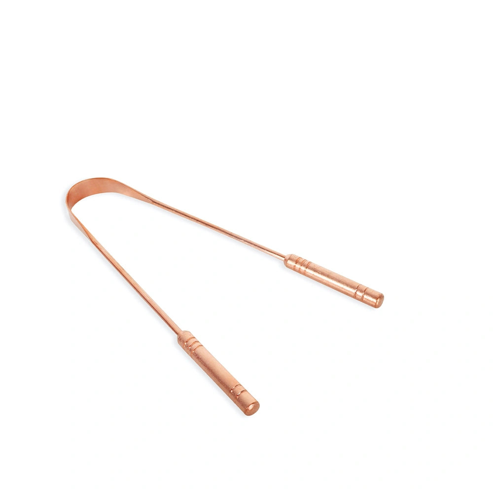 Ferramenta ayurvédica de cobre natural para limpeza da língua e apoio à saúde digestiva.